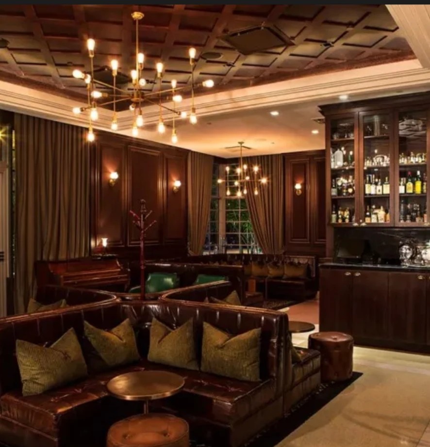 The Regent Cocktail Club lounge with leather banquettes and brass chandeliers